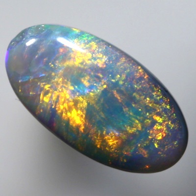 SOLID SEMI BLACK OPAL Golds over green and blue